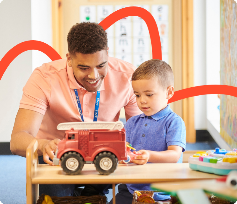 Early Years Practitioner playing with a child at nursery